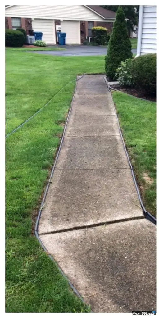 Large scale pressure washing equipment cleaning an HOA common area in central Kentucky.