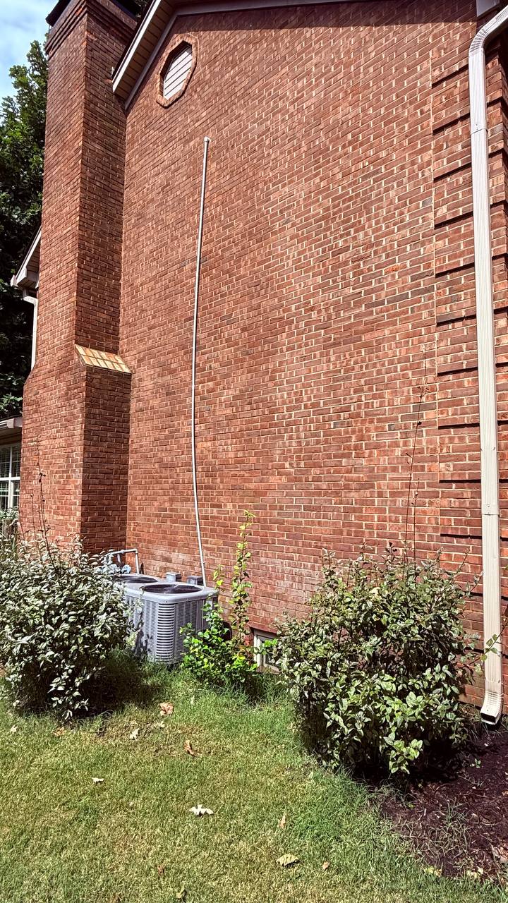 Same brick wall completely clean after rust stain removal treatment in Lexington KY