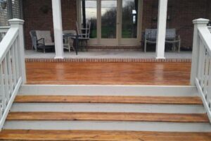 a porch with outdoor furniture