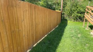 Fence cleaned and stained to restore color