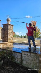 Cleaning neighborhood entryway sign and masonry