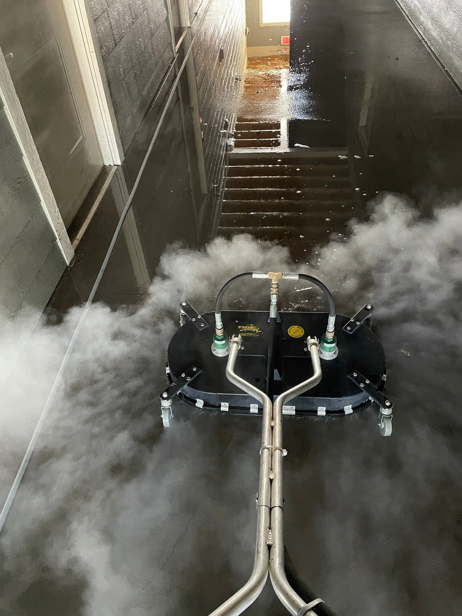 Surface cleaning breezeway concrete with rotary cleaner