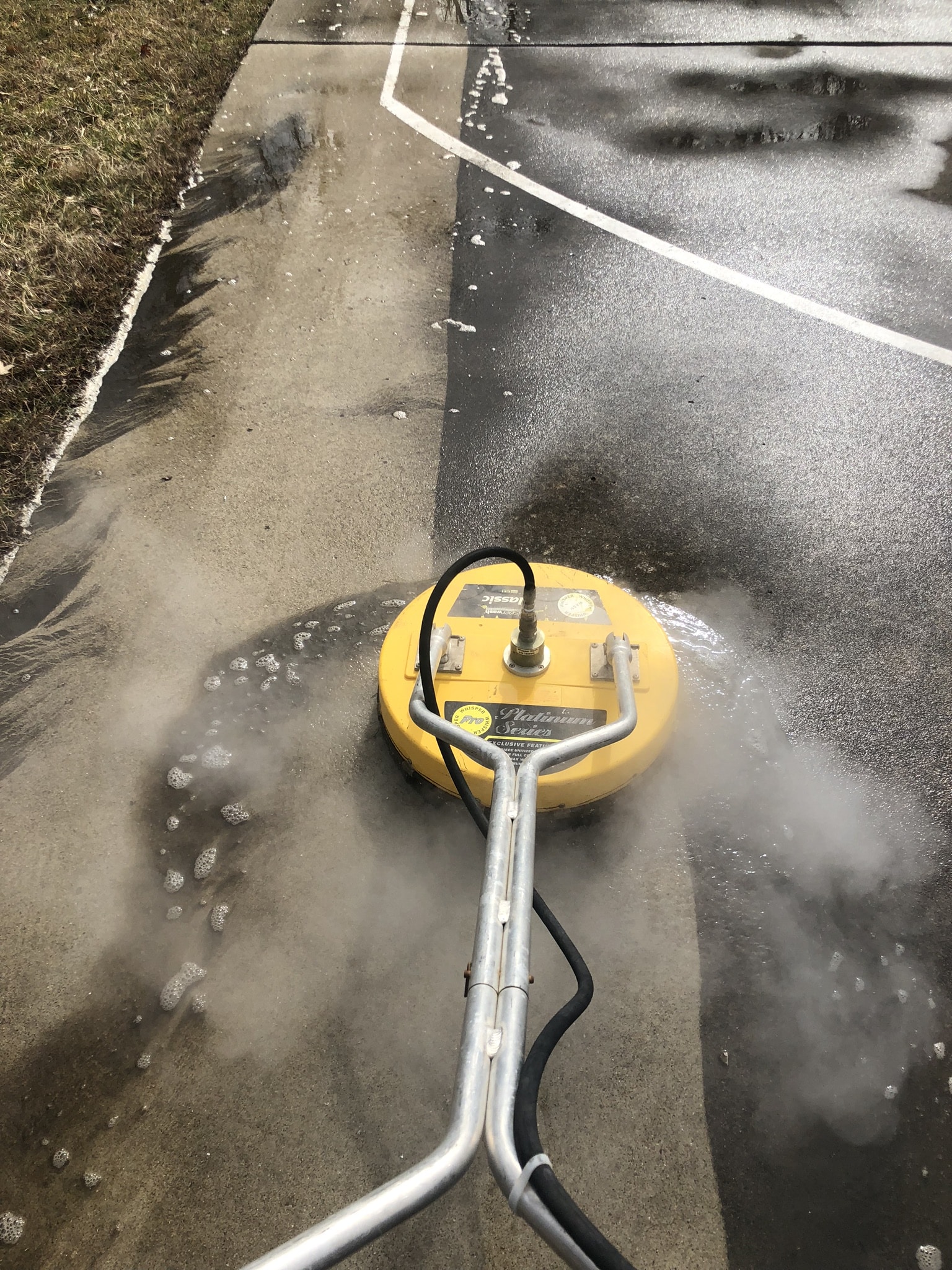 Small power washer cleaning up a basketball court